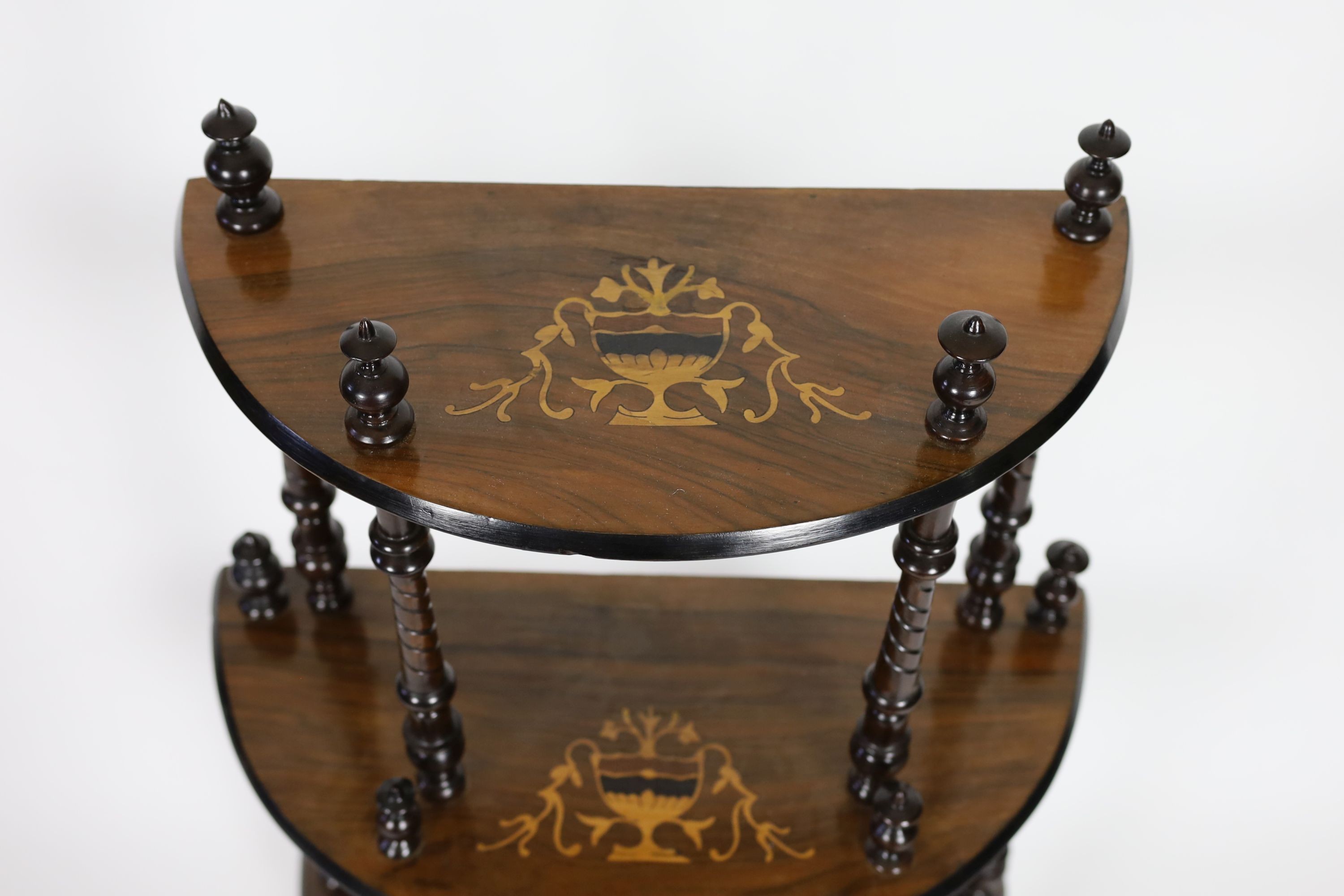 A late Victorian inlaid walnut D shaped four tier whatnot, width 59cm depth 28cm height 129cm